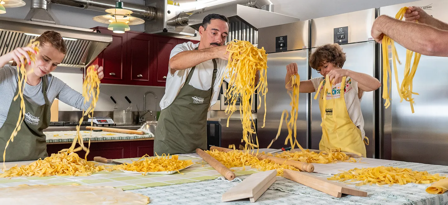 Making handmade pasta in a cooking class